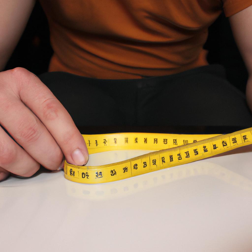 Person holding measuring tape, analyzing