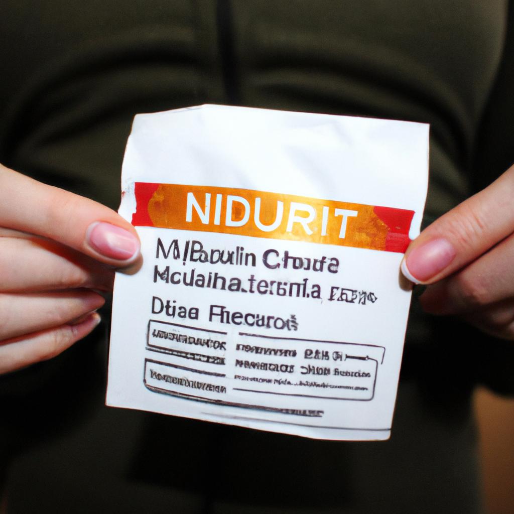 Person holding food nutrition label
